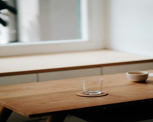 A quiet morning setting with a warm cup on a table